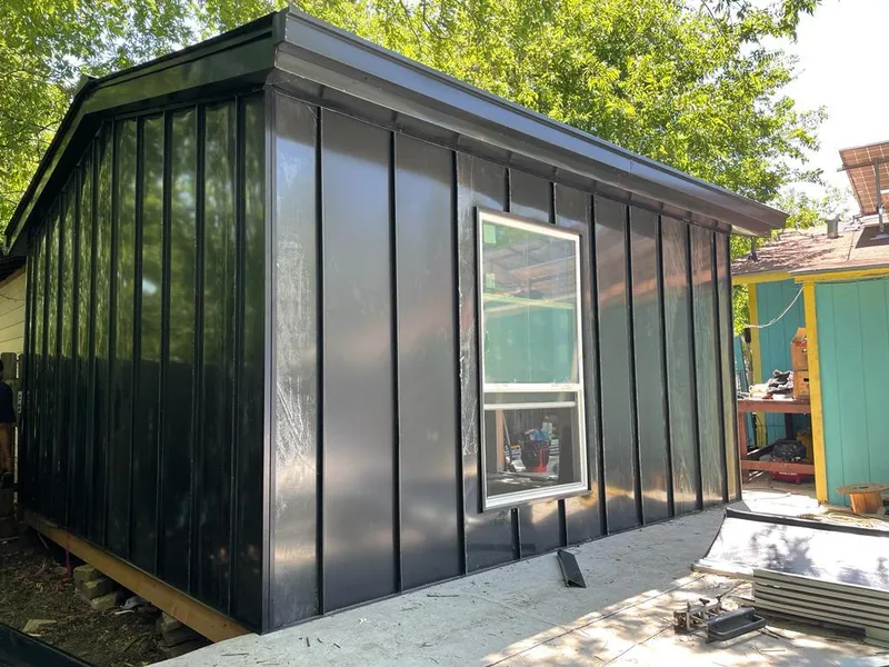 Black standing seam metal wall panels for Roof Inspection in Norco